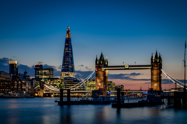 London skyline at night featuring The Shard and Tower Bridge
